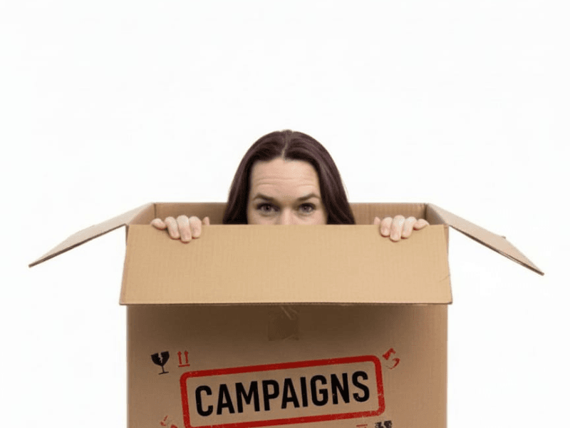 Katie Roberts popping out of a cardboard box Katie Roberts popping out of a cardboard box